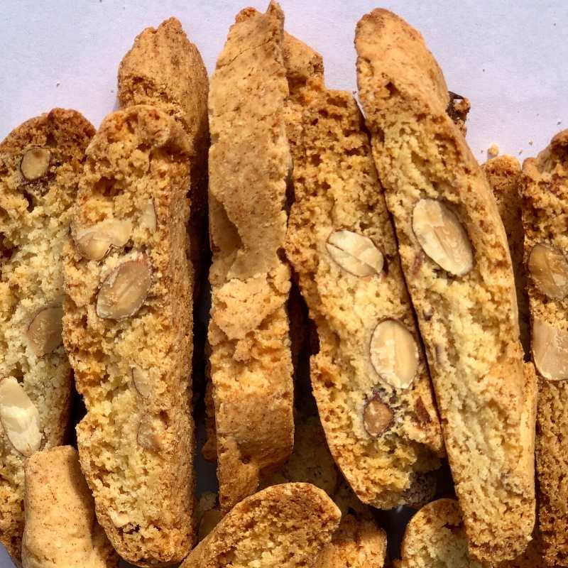 Group of classic almond biscotti stacked together on a tray