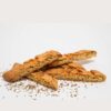 Anise Biscotti with a crisp golden edge and visible anise seeds, photographed in natural bakery light