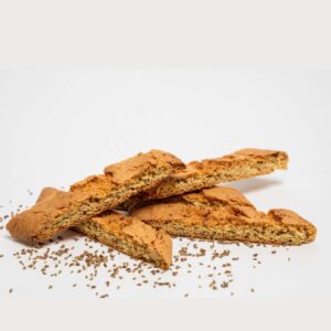 Anise Biscotti with a crisp golden edge and visible anise seeds, photographed in natural bakery light