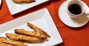 Flat lay of espresso and assorted biscotti including almond, chocolate, and pistachio biscotti from The Biscotti Company
