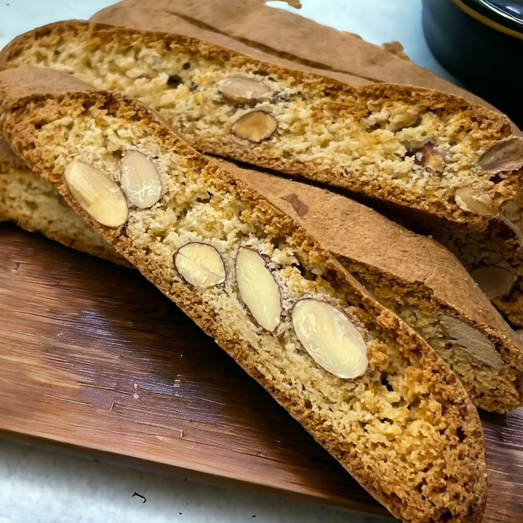Gluten free almond biscotti with roasted almond pieces and a crisp golden texture.