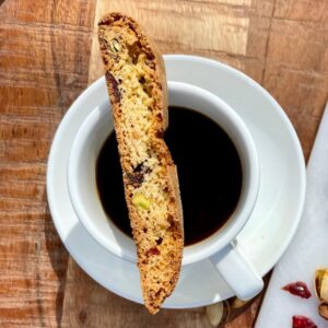 cranberry-pistachio-biscotti-on-coffee-cup-with-cranberry-and-pistachio