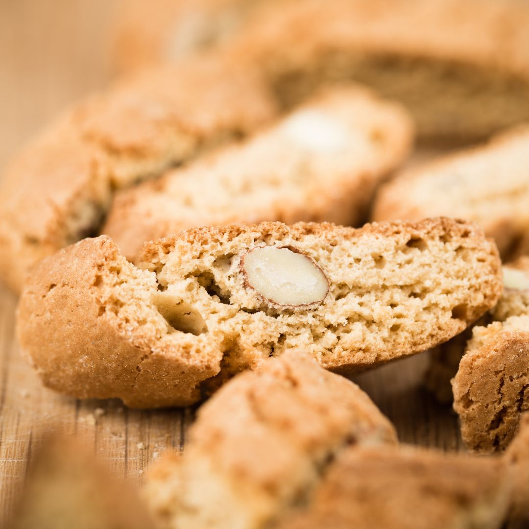 Almond Biscotti Close Up on Wooden Board Close-up almond biscotti on a wooden board with soft lighting