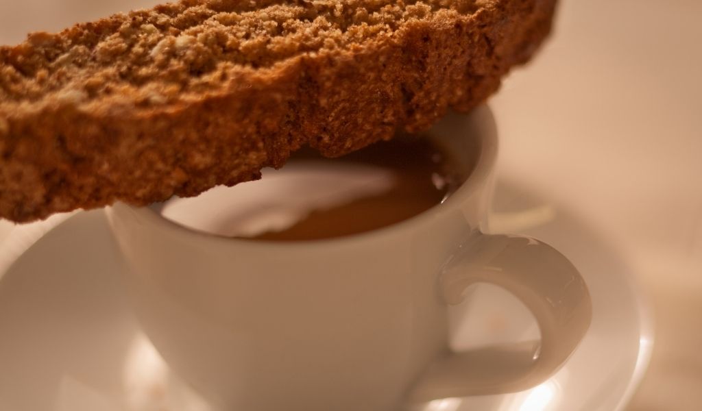 Biscotti resting on top of an espresso