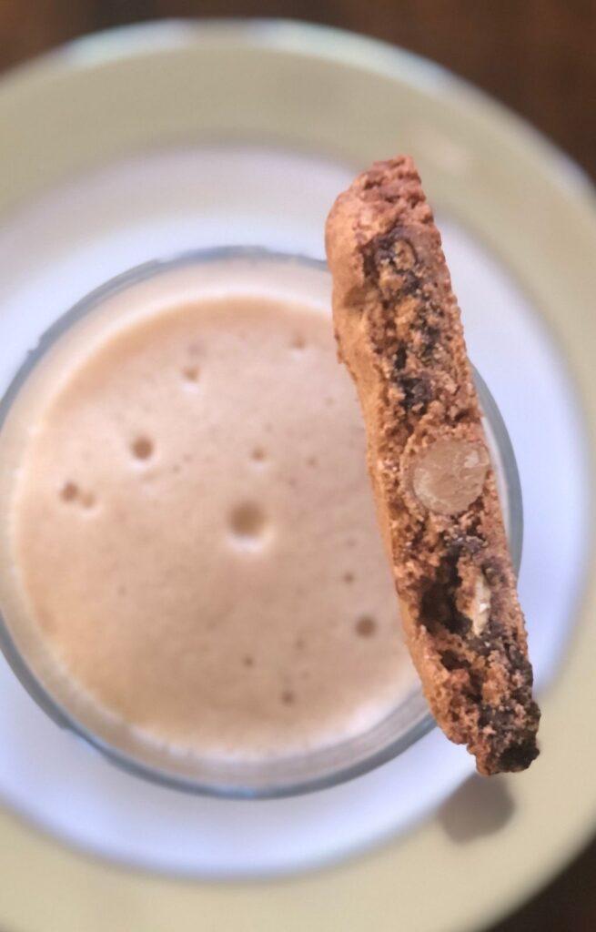 Chocolate almond biscotti served with a glass of milk
