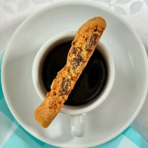 Biscotti resting on a cup of coffee, perfect for dunking