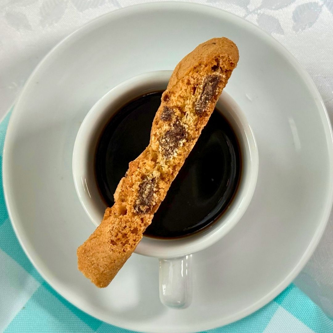 Biscotti resting on a cup of coffee, perfect for dunking
