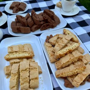 Chocolate Anise Biscottini served with Lemon and Amaretto Biscottini on white plates