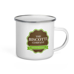 White ceramic mug with a brown circular label and green border reading 'The Biscuit Company' and a green ribbon 'Handcrafted Cookies'.