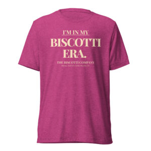 Pink heathered T-shirt with large cream text reading 'I'M IN MY BISCOTTI ERA.' on the back/center