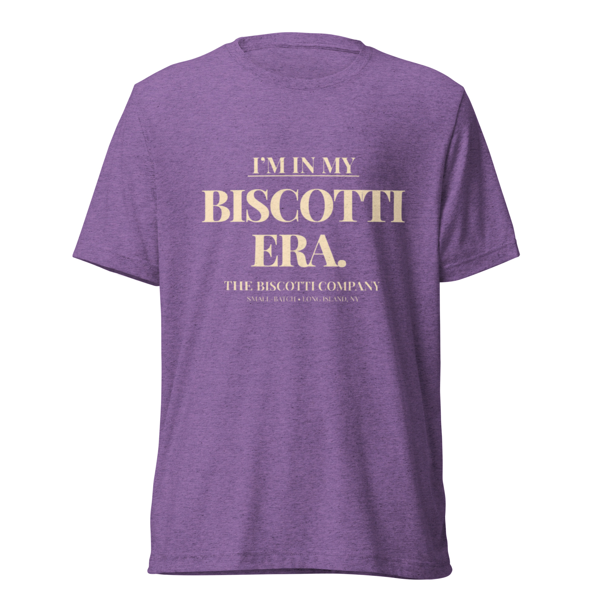 Purple heather T-shirt with cream text reading "I'M IN MY BISCOTTI ERA" on the chest.