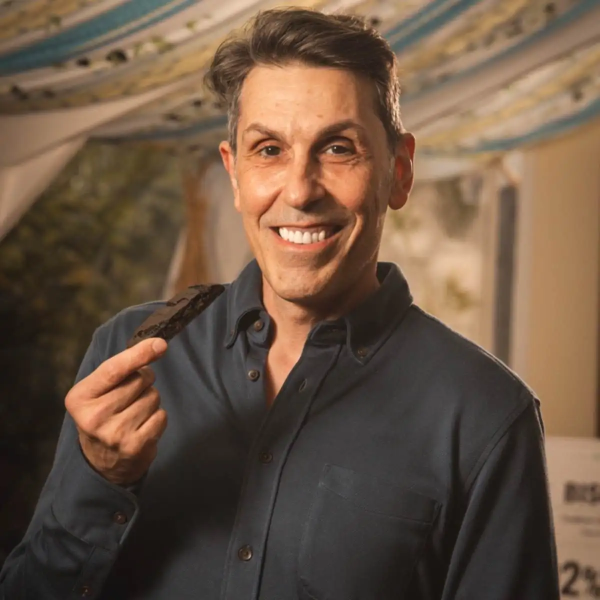 Bruno LoGreco tasting Double Chocolate biscotti on its own during The 2026 Biscotti Report event